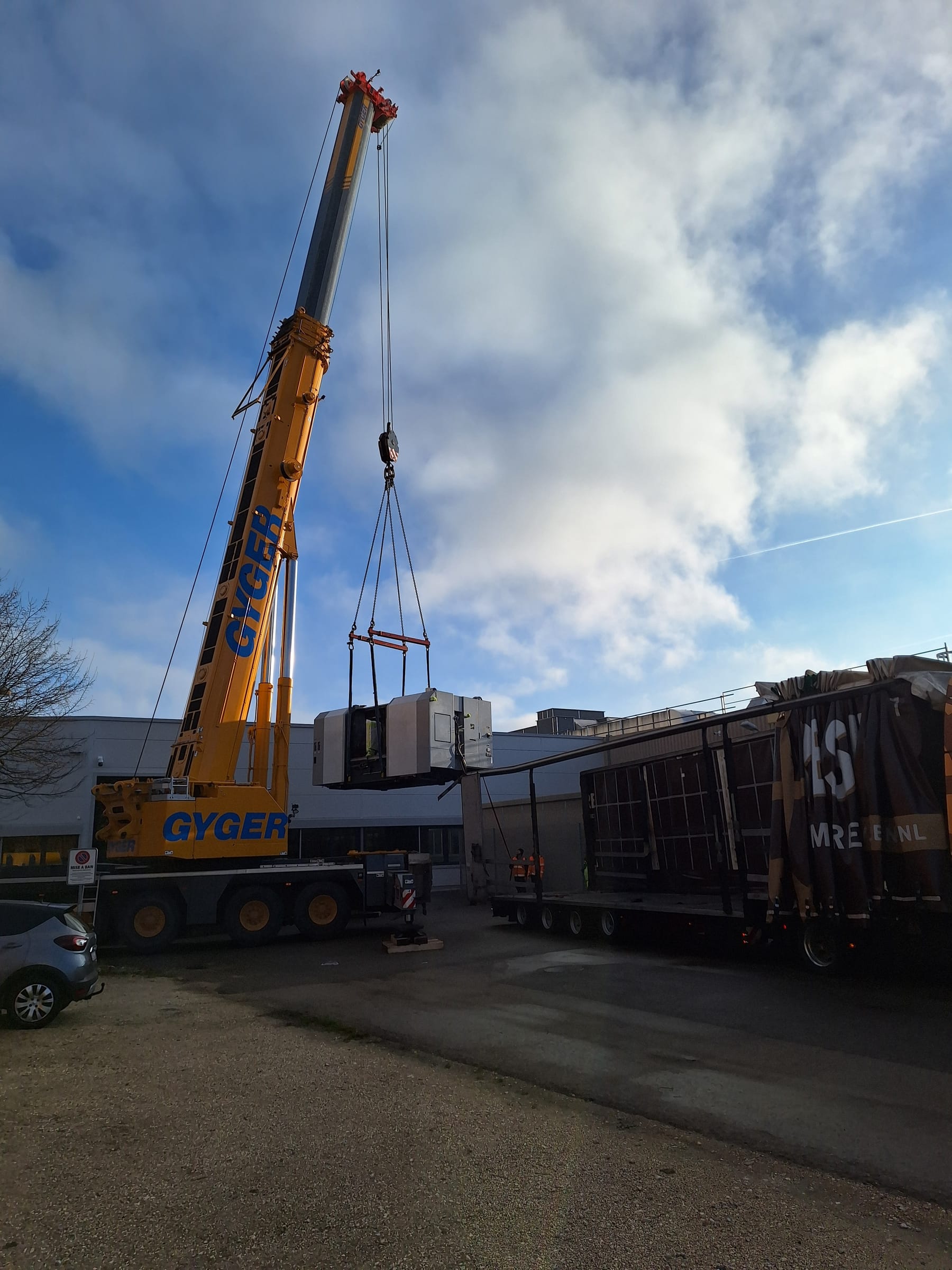 Machining center being loaded in a workshop